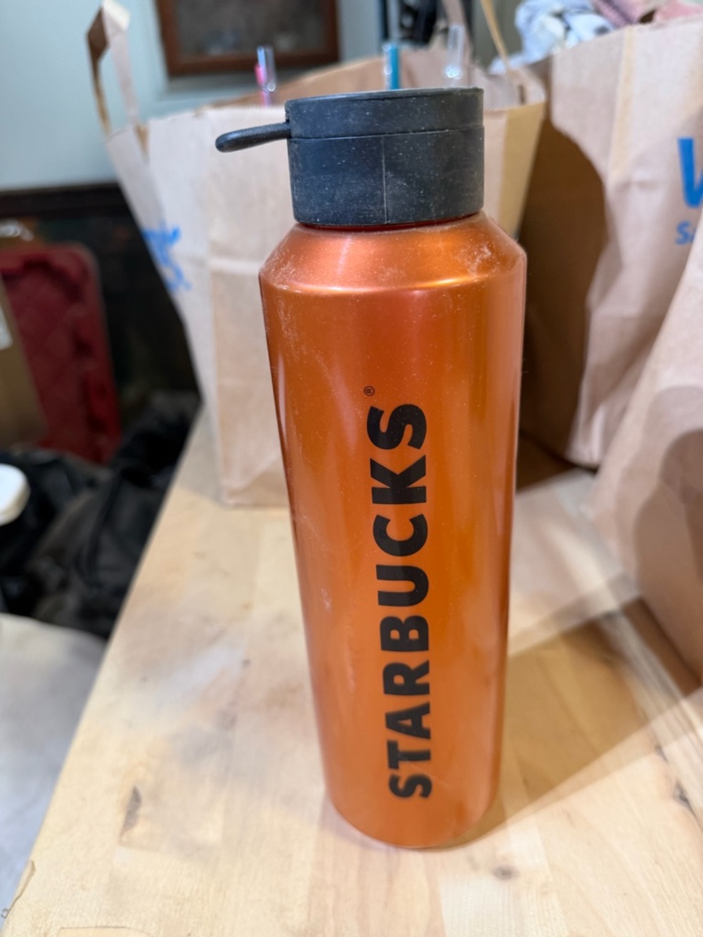 Starbucks Metallic Orange Tall Travel Bottle with Black Lid plastic.